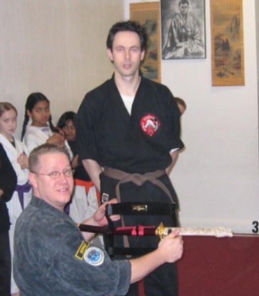 OMAR PRESENTS SENSEI WITH A SWORD